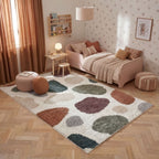 Children's bedroom with a patterned rug, pink bed, and decorative pillows.