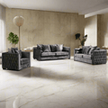 Gray velvet sofa set in a modern living room with marble flooring and walls.