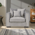Gray armchair with decorative pillows in a living room setting