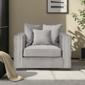 Gray armchair with decorative pillows in a living room setting