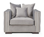 Gray armchair with decorative pillows on a white background