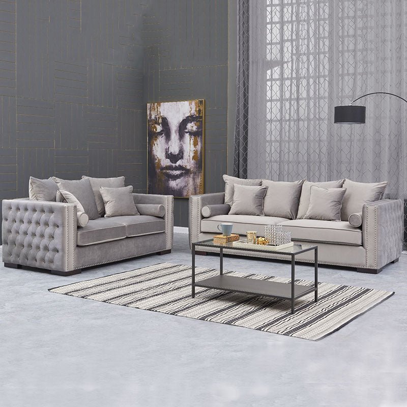 Modern living room with gray sofa set and decorative elements.