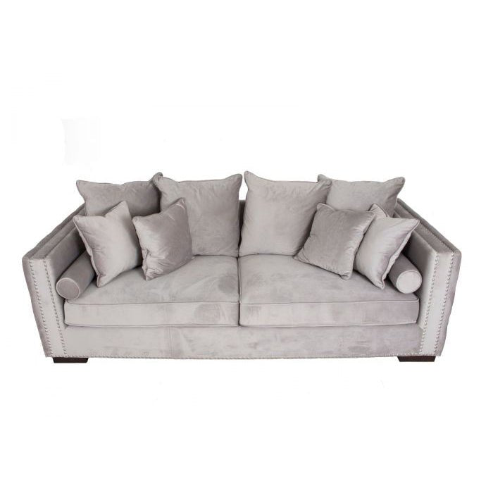 Gray sofa with decorative pillows on a white background