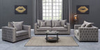 Gray living room set with matching armchair, sofa, and coffee table in a modern interior setting.