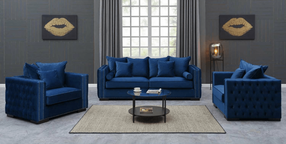Blue sofa set in a living room with decorative elements.