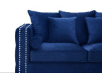 Blue sofa with decorative pillows on a white background