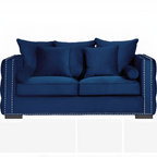 Blue sofa with decorative pillows on a white background