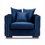 Blue armchair with three matching pillows on a white background