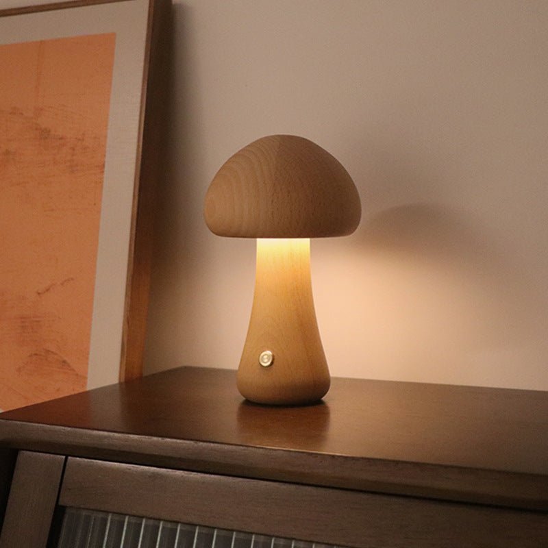 A collection of mushroom-shaped wood lamps in various colors illuminated, displayed on a shelf.