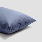 Blue pillow on a light gray background