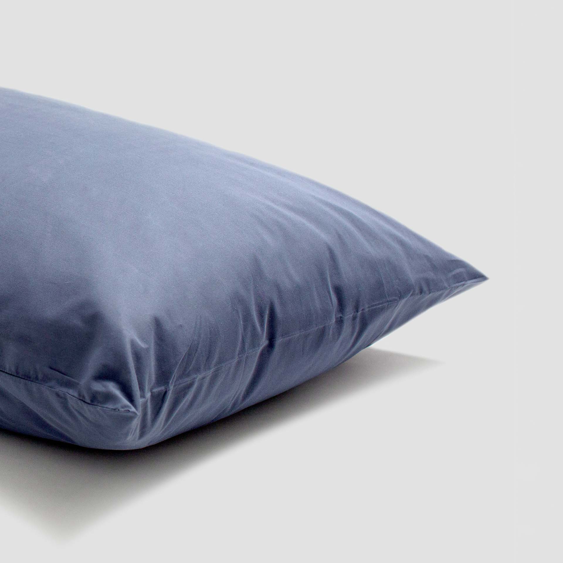 Blue pillow on a light gray background
