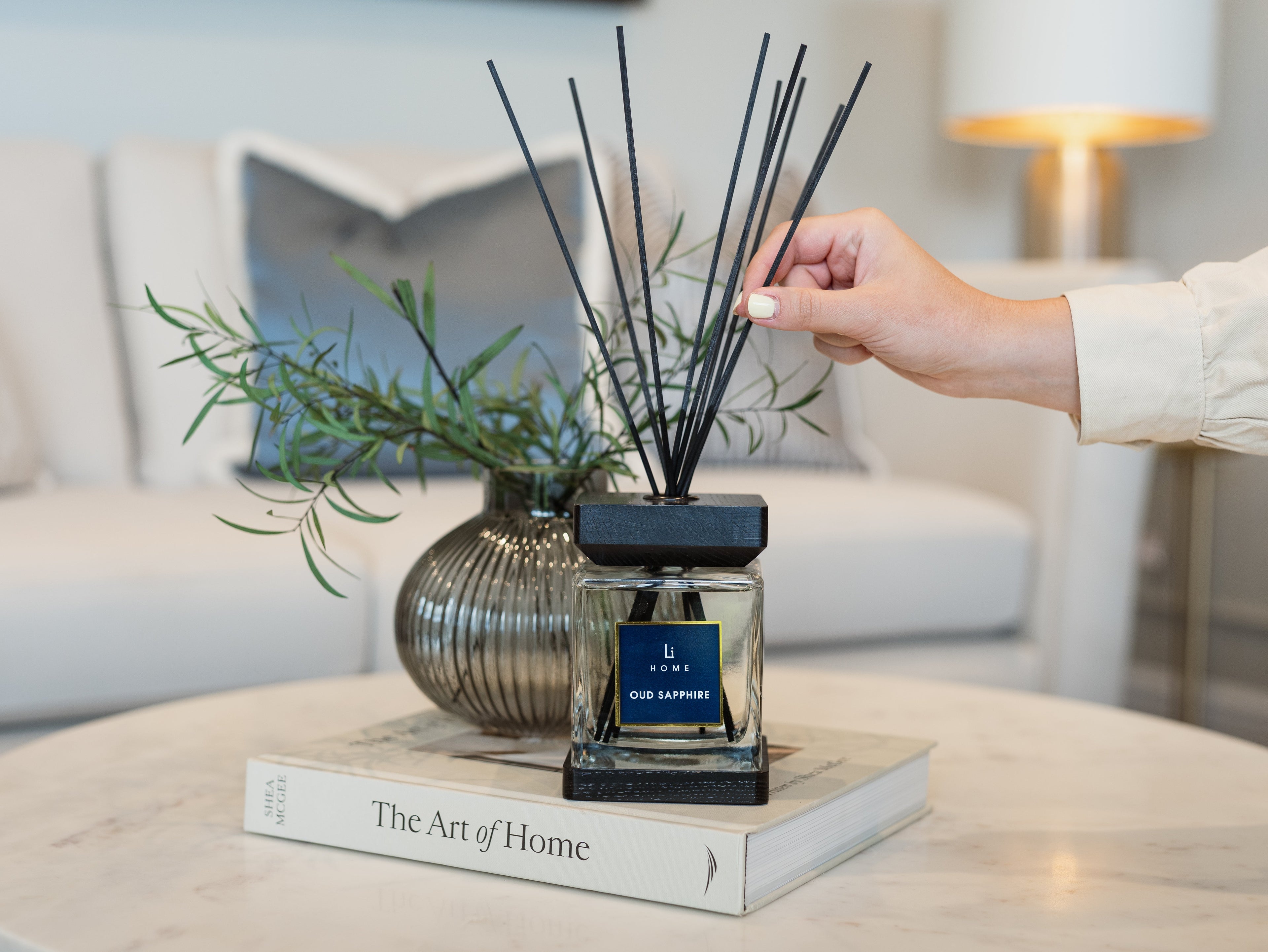 Person using a diffuser on a book with a blurred background