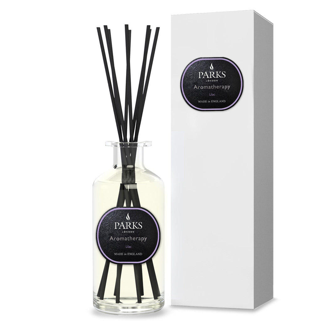Parks aromatherapy diffuser bottle with black sticks and packaging on a white background