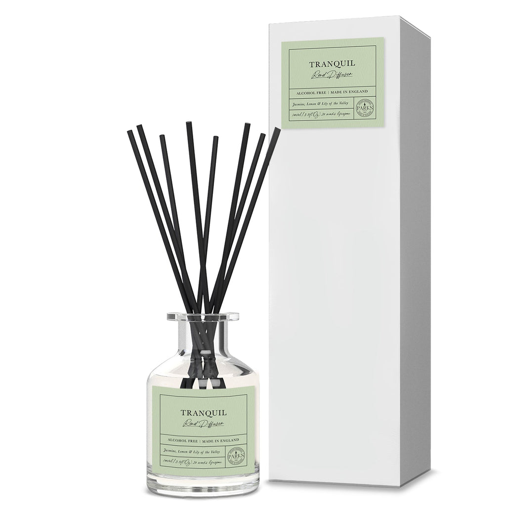 Reed diffuser labeled 'Tranquil' with black reeds and a white box on a white background