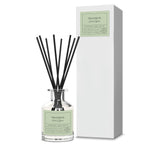 Reed diffuser labeled 'Tranquil' with black reeds and a white box on a white background
