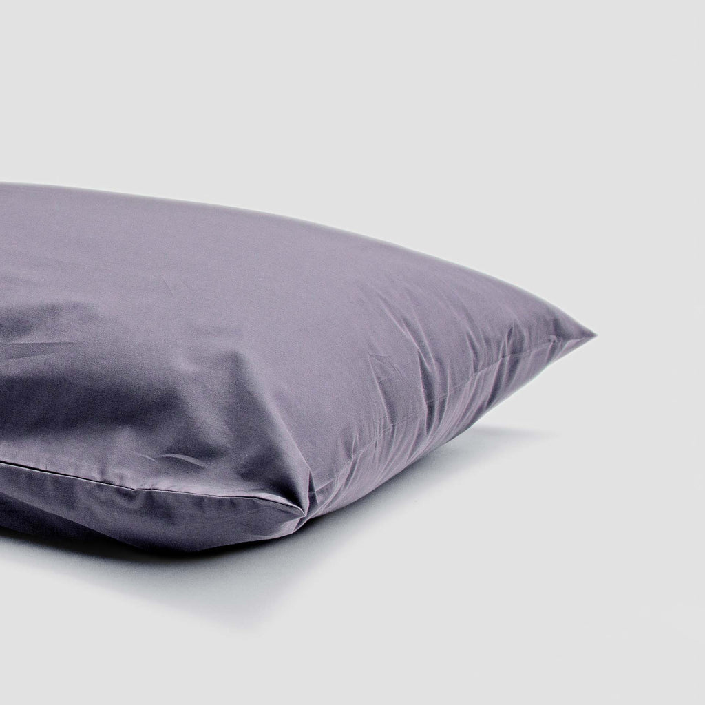 Purple pillow on a light gray background