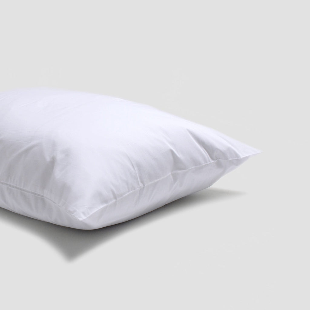 White pillow on a light gray background