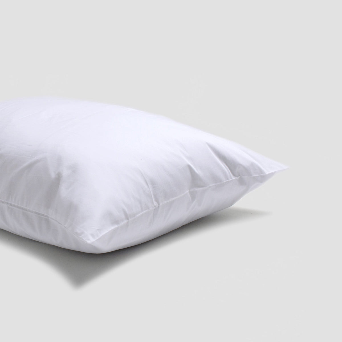 White pillow on a light gray background