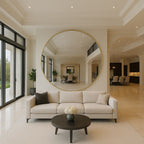 Modern living room with a large round mirror, beige sofa, and wooden coffee table.