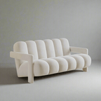 Modern white sofa against a plain wall