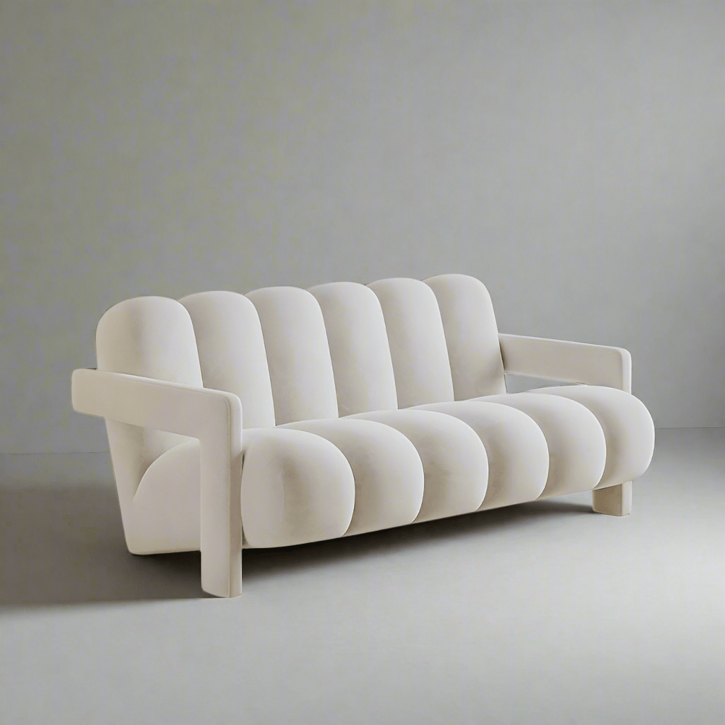 Modern white sofa against a plain wall