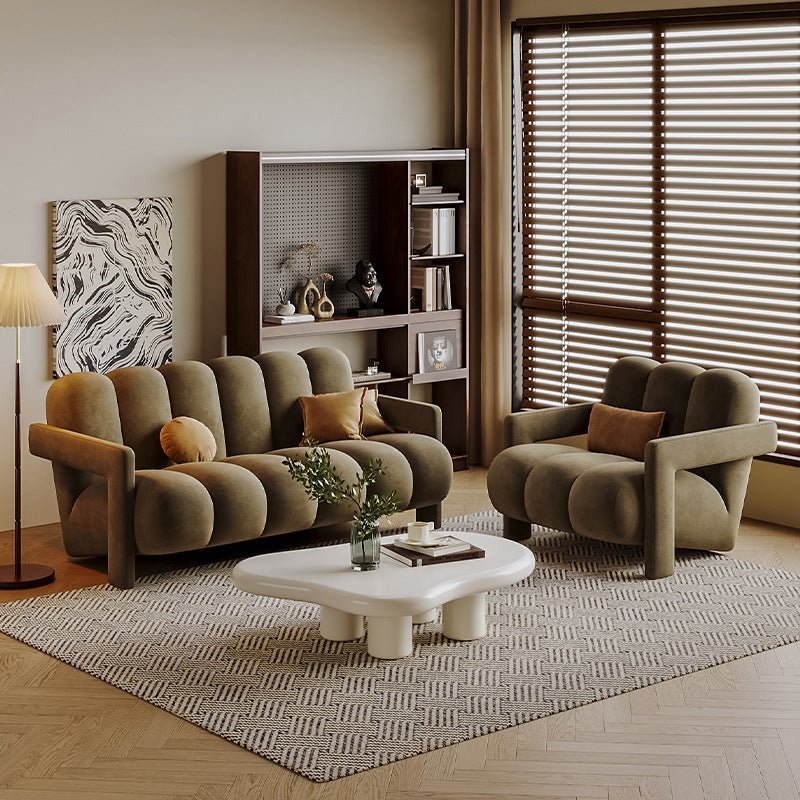 Modern living room with brown sofa, armchair, and coffee table.