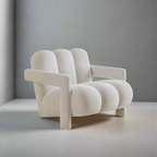 Modern white armchair against a gray wall