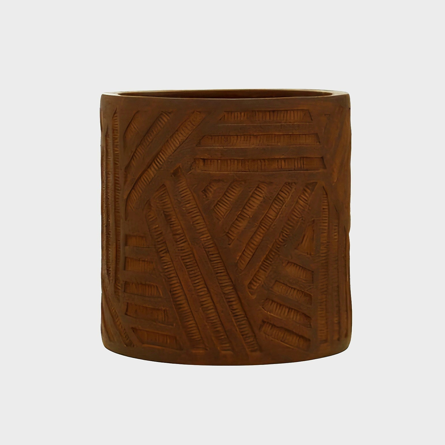 A cylindrical brown planter with a carved geometric basketweave pattern, shown against a plain light gray background.