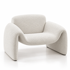 Modern curved armchair upholstered in textured off-white bouclé fabric, shown on a clean white studio background.