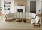 Modern living room with a white sectional sofa, coffee table, and decorative items.