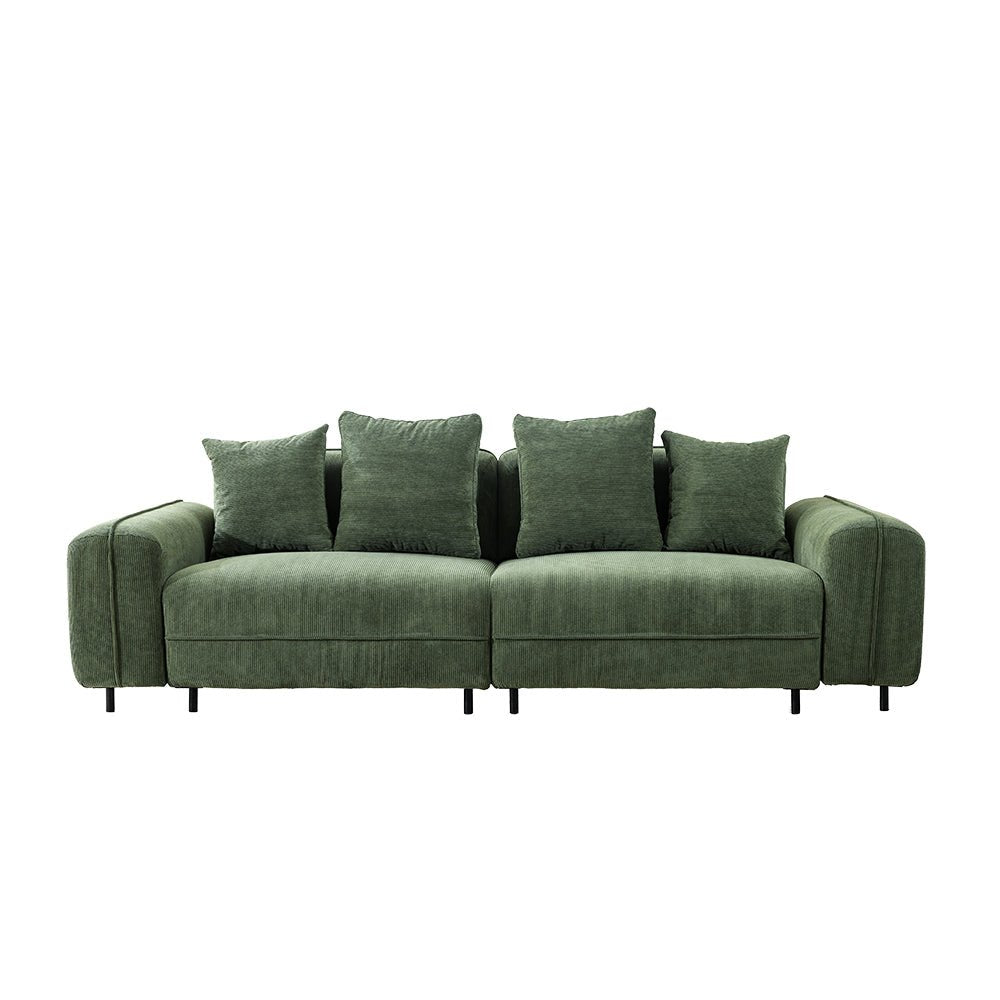 Green sofa with four cushions on a white background