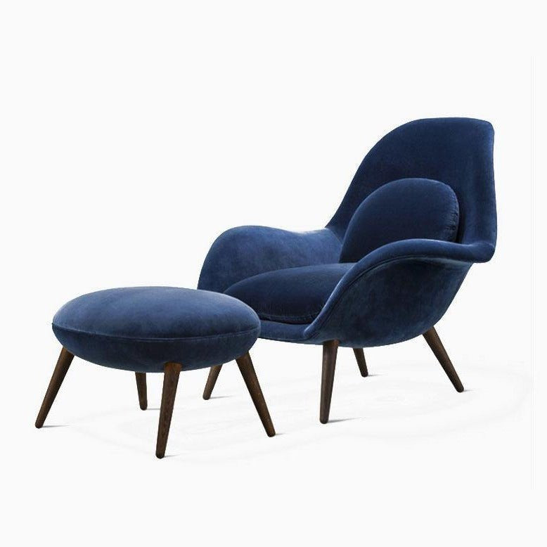 Blue armchair with matching ottoman on a white background