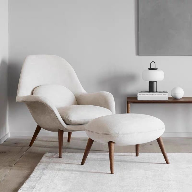 Beige armchair with ottoman in a minimalistic room