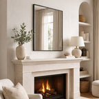 Cozy living room with a fireplace, mirror, and decorative items.