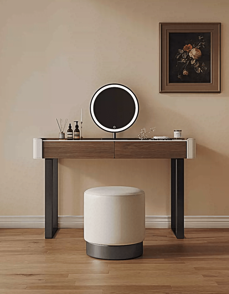 Dressing table with round mirror and stool in a room setting