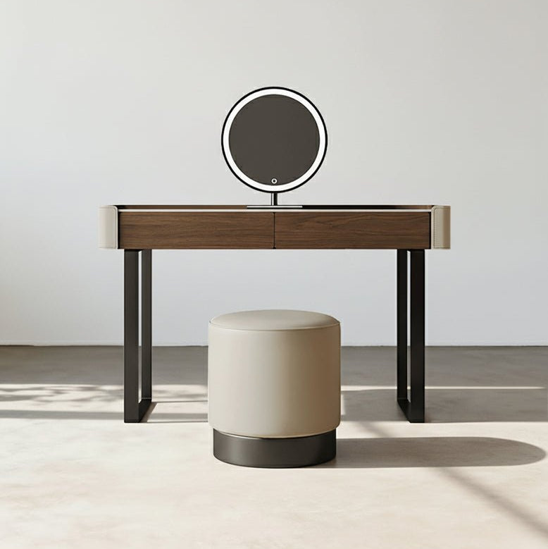 Dressing table with a round mirror and stool on a light background