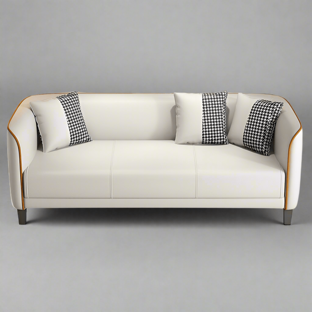 White sofa with black and white patterned cushions on a gray background