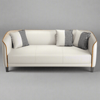 White sofa with black and white patterned cushions on a gray background