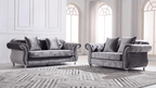Gray velvet sofa set in a stylish room with large windows.