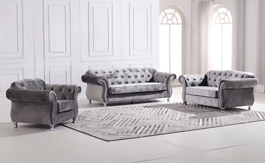 Gray velvet sofa set in a room with white walls and large windows.