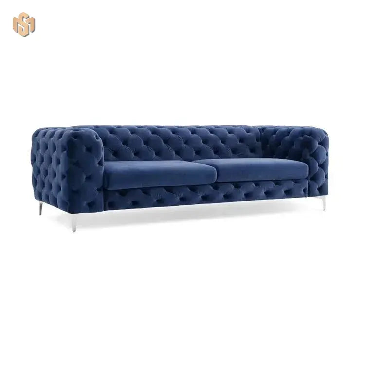 Blue tufted sofa on a white background