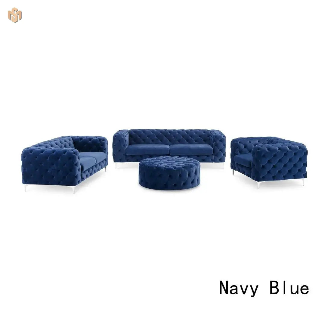 Navy blue tufted sofa set with ottoman on a white background