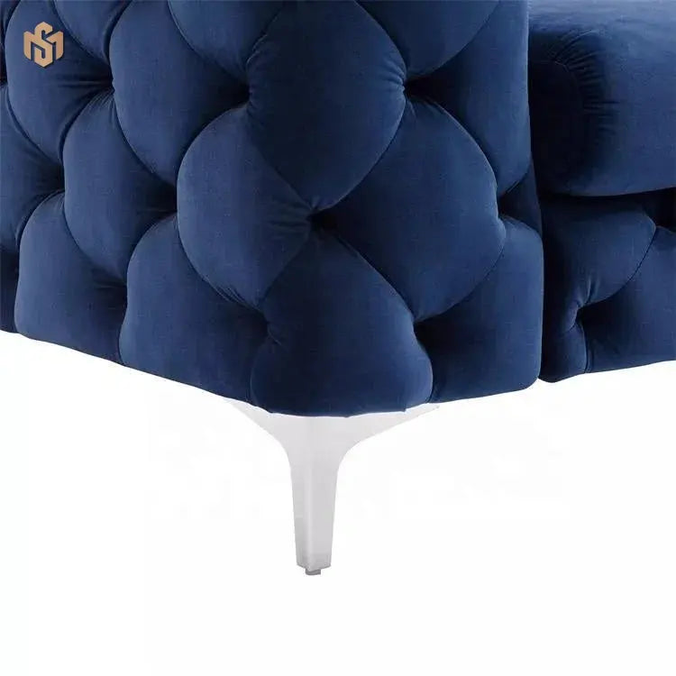 Navy blue tufted headboard with a white base on a white background