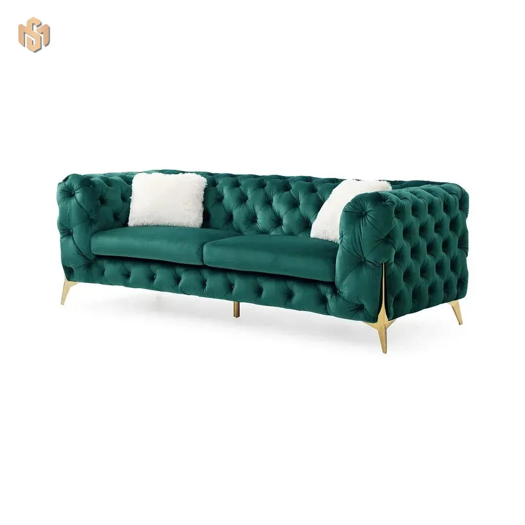Green tufted sofa with white cushions on a white background