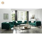 Green velvet sofa set in a modern living room with large windows.