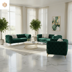 Modern living room with green velvet sofas, a coffee table, and decorative plants.