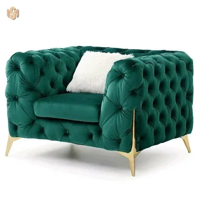 Green tufted sofa with gold legs on a white background