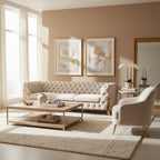 Modern living room with beige sofa, armchair, and abstract art on the wall.