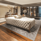 Decorative sofa in a stylish living room with large windows.