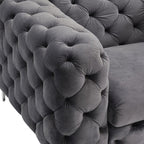 Gray tufted velvet sofa with a close-up of the buttoned texture.